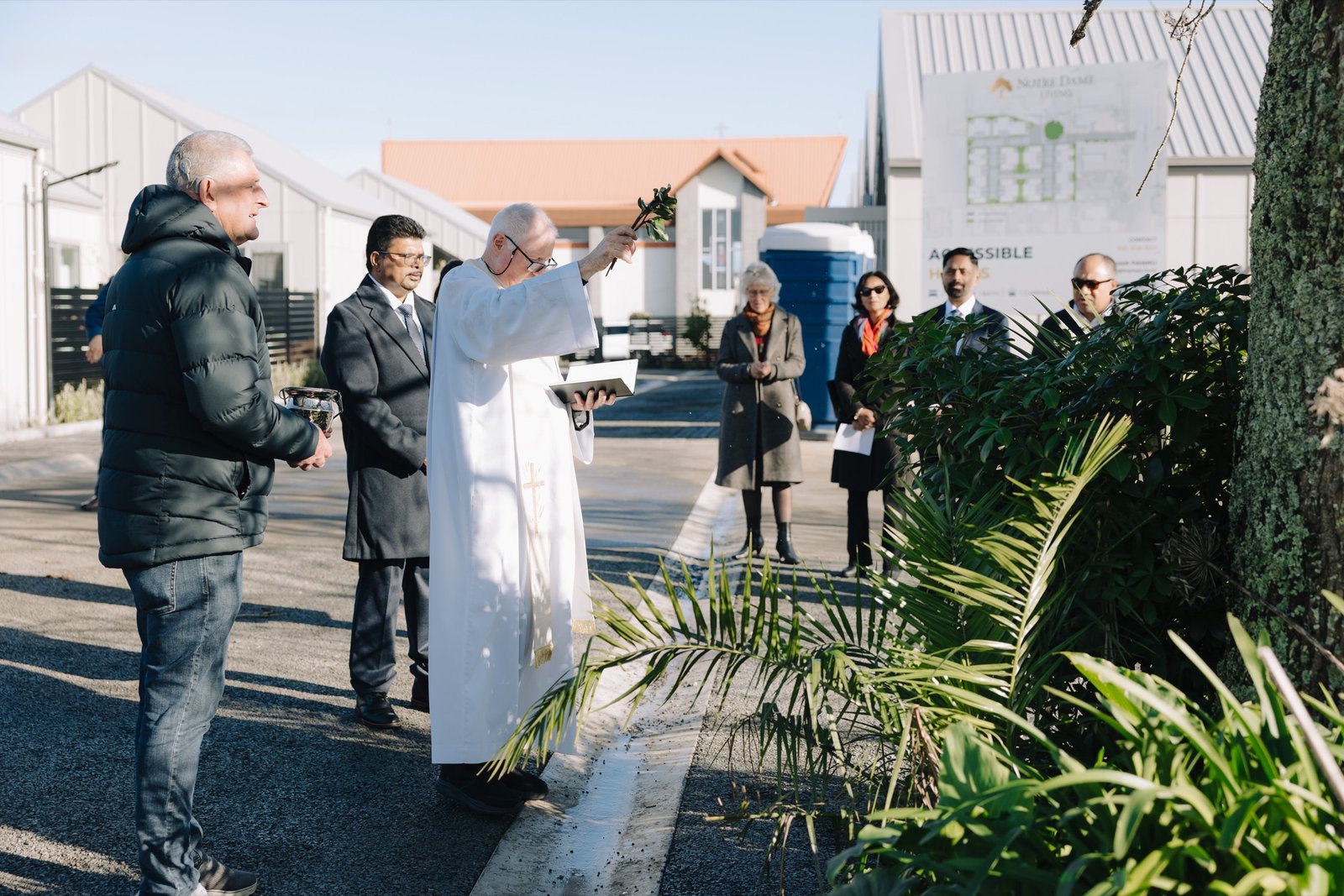 Community blessing beside the historic church precinct