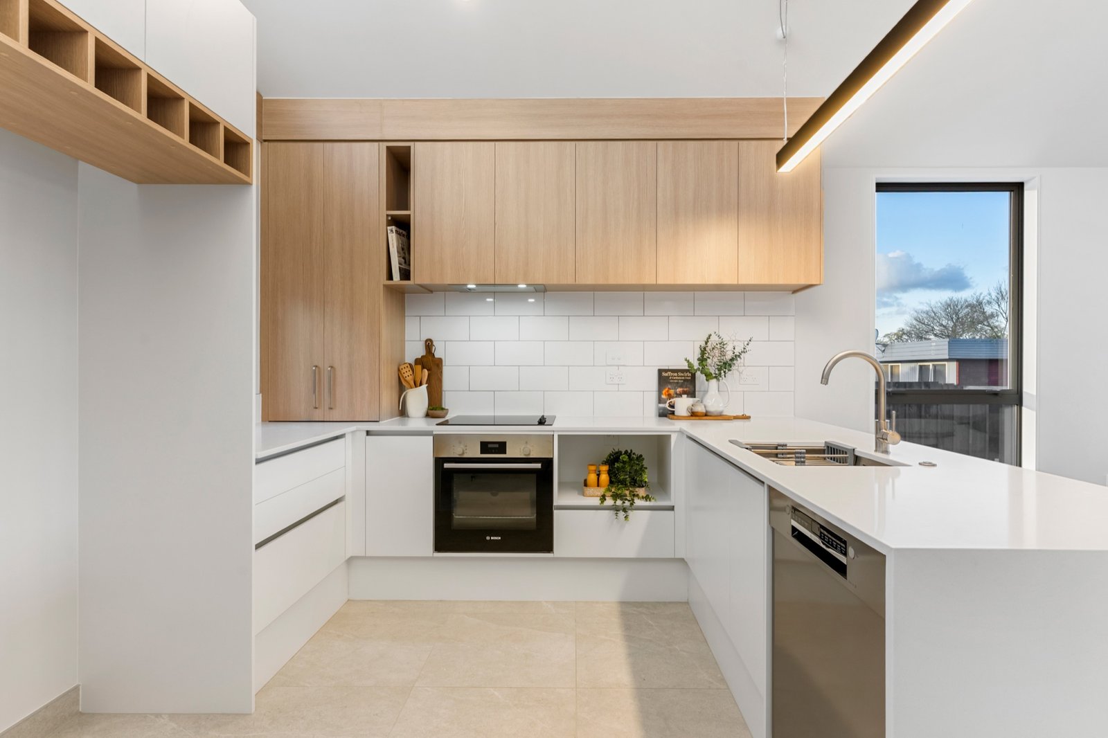 Timber and white kitchen in a completed Notre Dame Living home