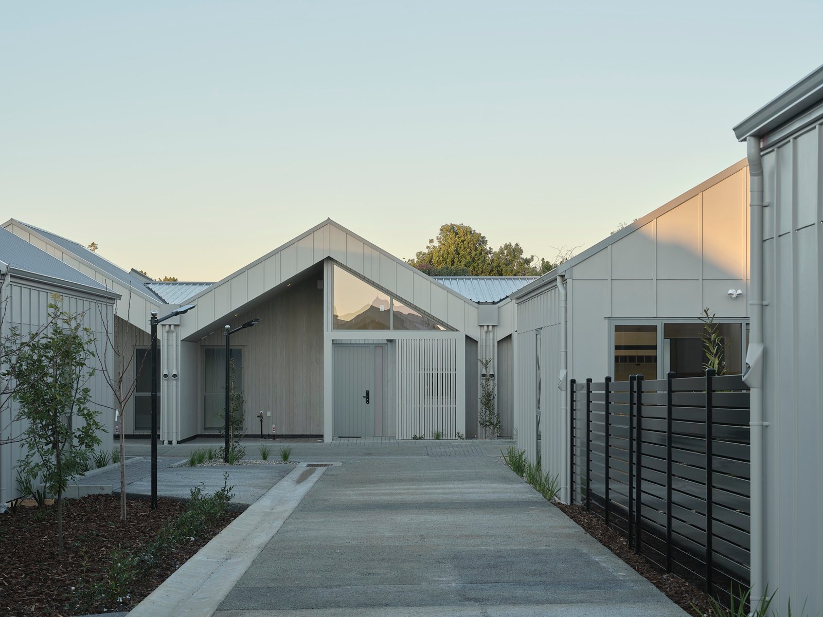 Completed Notre Dame Living homes in soft evening light